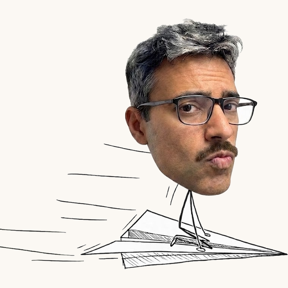 Raj flying a paper plane